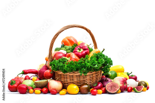 Fototapeta Naklejka Na Ścianę i Meble -  Fresh organic vegetables in wicker basket isolated.