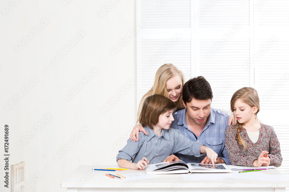 Fototapeta premium Happy family. Parents and children are engaged together.