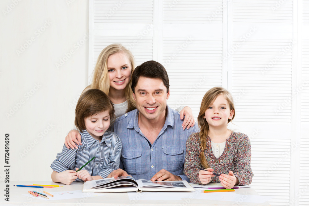 Happy family. Parents and children are engaged together.