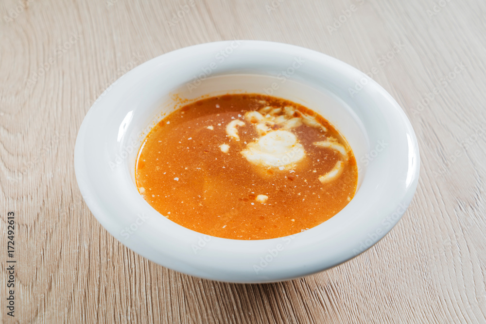 soup on the wooden background soup on the wooden background
