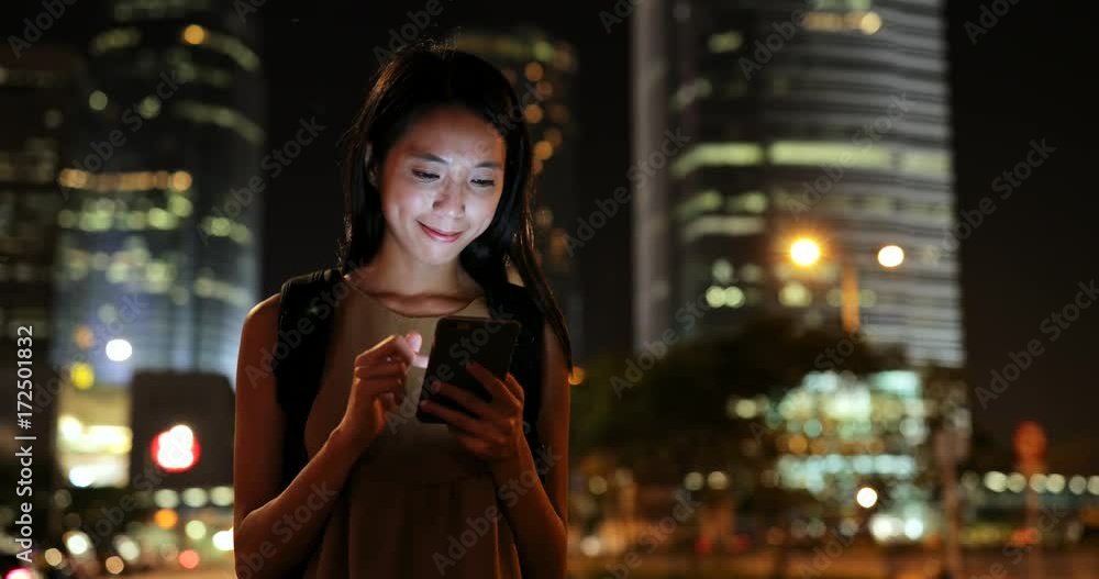 Woman using mobile phone at night Woman using mobile phone at night
