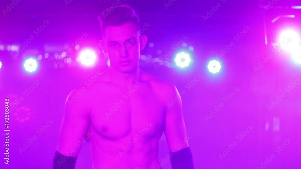 Man undresses in night club lights Man undresses in night club lights