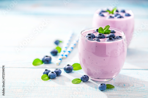 Healthy blueberry smoothie on rustic wooden background. Selectiv