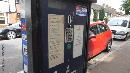 Parking payment terminal. A man pays for parking. photo