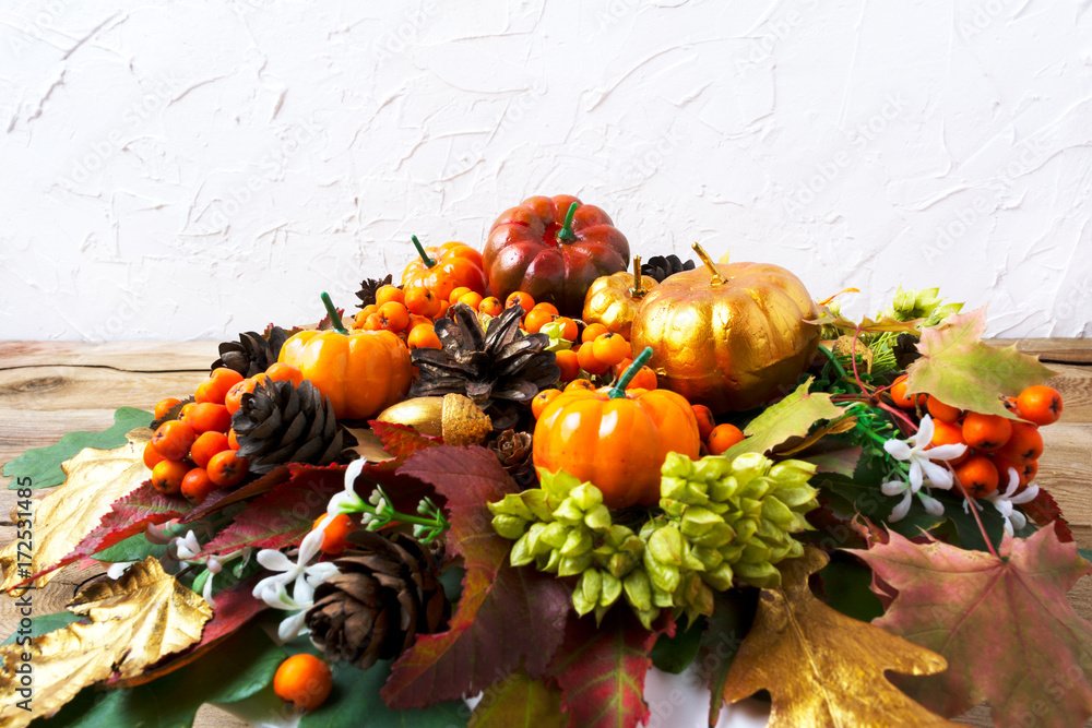 Thanksgiving greeting background with pumpkins and leaves table centerpiece