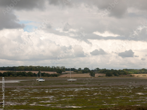 estuary scene tide out boats moored manningtree overcast photo