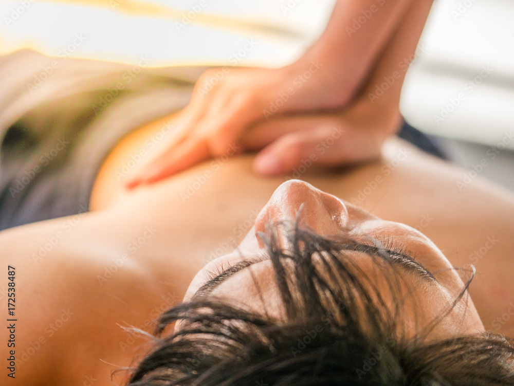 Naklejka premium A set-up acting of a man being unconscious while having an exercise and having a woman making the CPR for the first aid. Selective focused