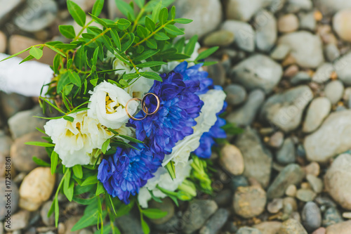 Bridal bouquet lying on the rocks photo