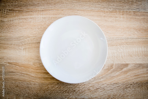 withe plate on wooden background
