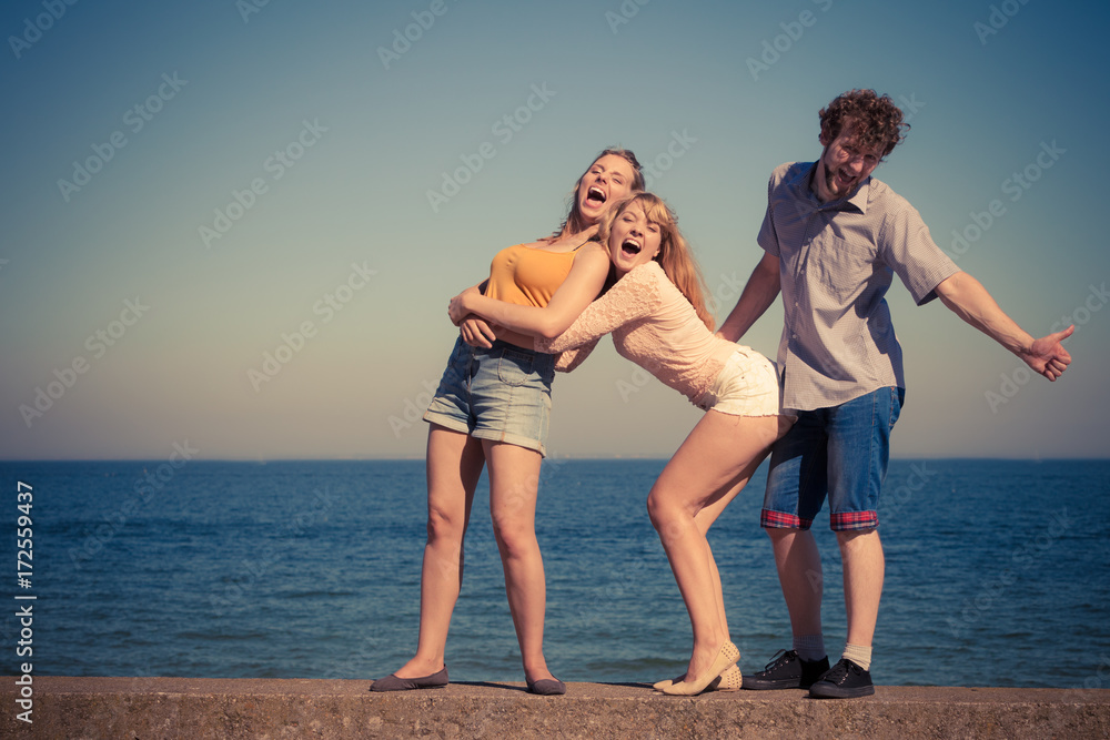 Group friends boy two girls having fun outdoor Group friends boy two girls having fun outdoor
