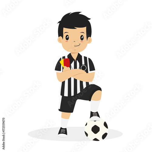 Happy boy wearing soccer referee jersey, with his arm crossed while holding red and yellow card and his left foot on a soccer ball cartoon vector