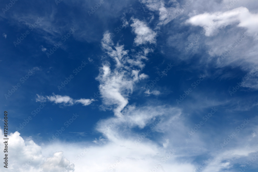 White clouds on blue sky for background.