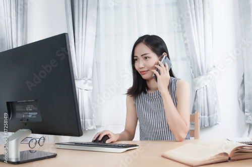 Asian woman working at home.