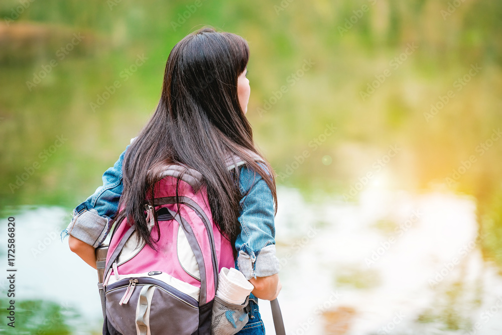 Asian teenage girls are dressing adventure tourism, mountain climbing rocks. Asian teenage girls are dressing adventure tourism, mountain climbing rocks.