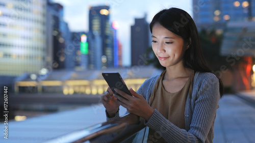Free Download Woman using smart phone in Hong Kong at night - GFXLoad