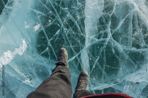 Fototapeta Naklejka Na Ścianę i Meble -  Walking on the frozen lake