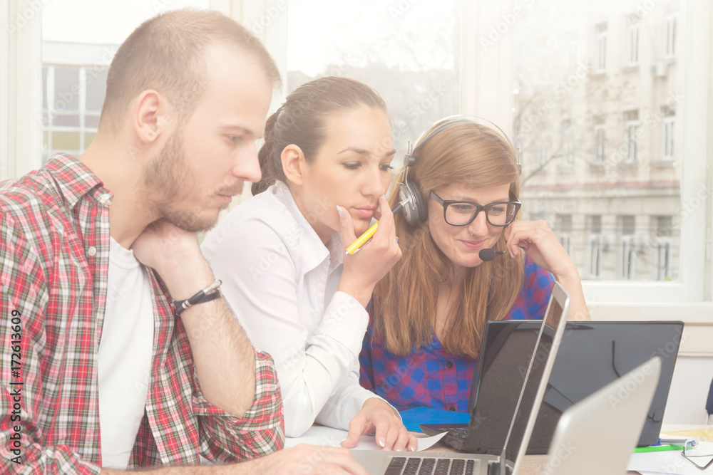 Group of young ordinary people working in the office. Group of young ordinary people working in the office.