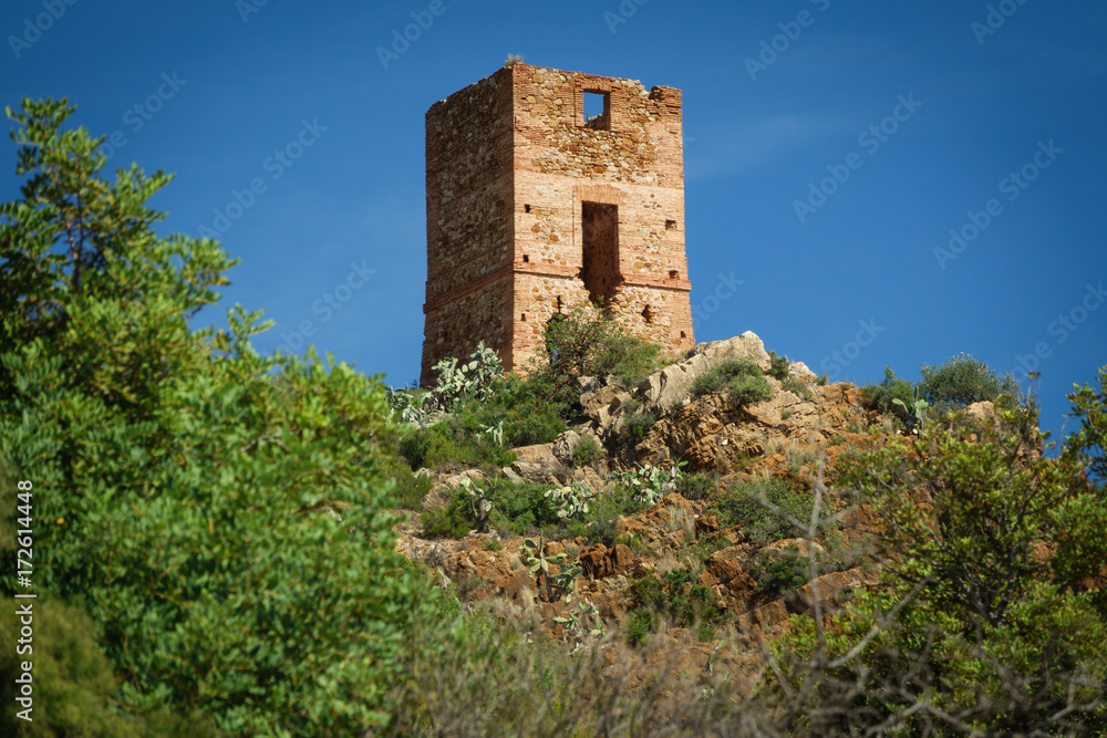 Antique stone tower over hill