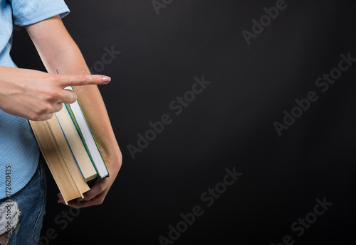 Wallpaper Mural Closeup view of student female holding books Torontodigital.ca