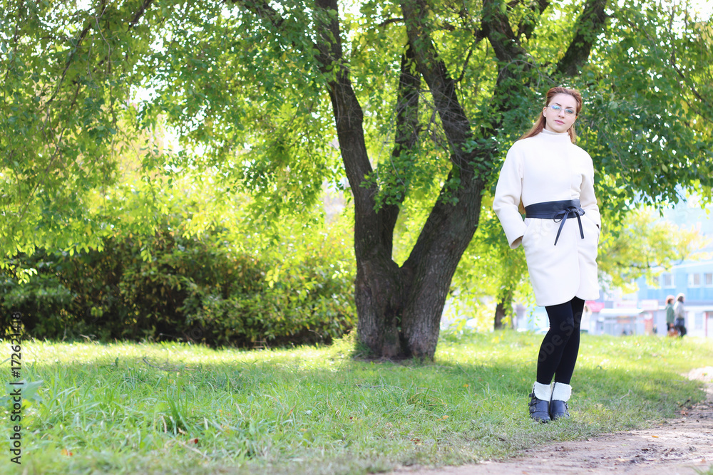 girl walking in the park in autumn girl walking in the park in autumn