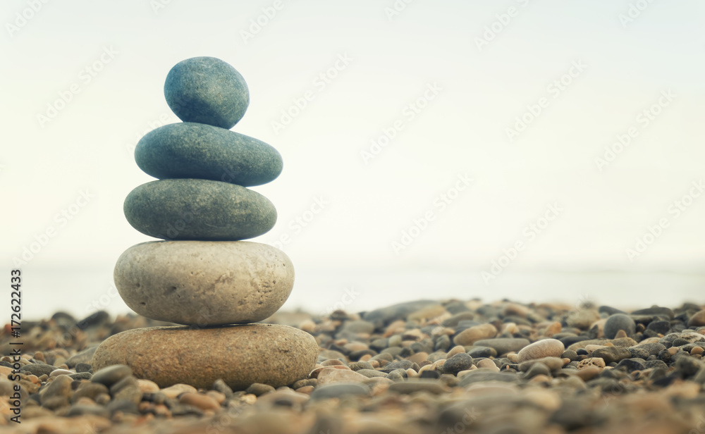 Stack Of Balanced Stones On The Beach