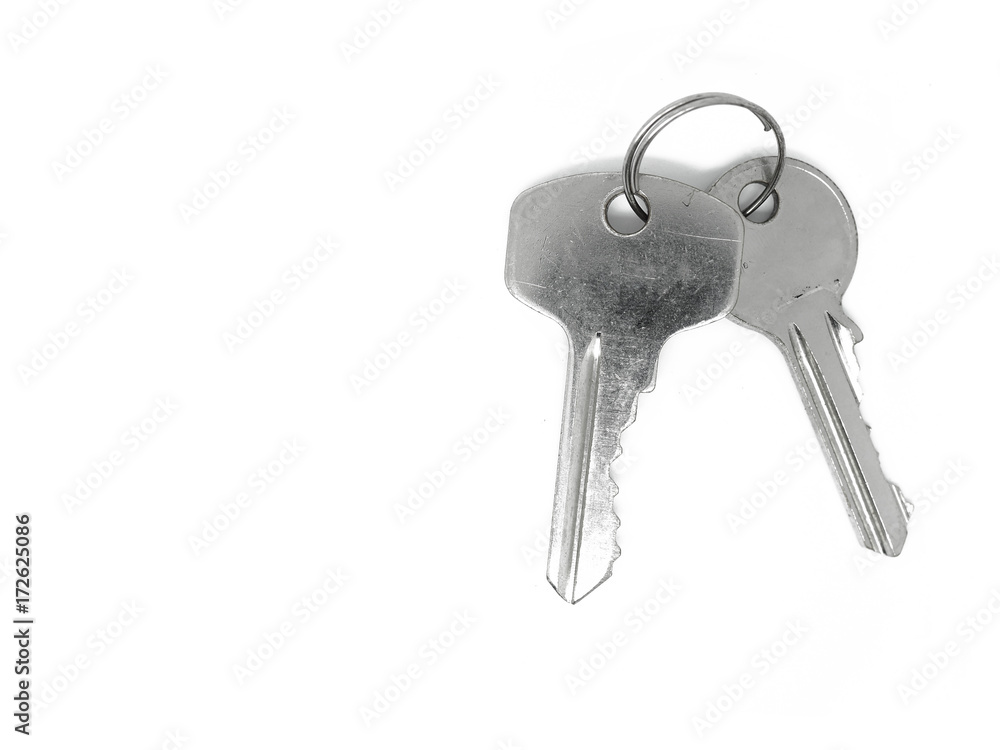 Top view two shiny silver color iron steel keys with ring, on white background isolated, with clipping path Top view two shiny silver color iron steel keys with ring, on white background isolated, with clipping path