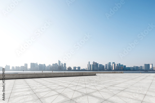 empty marble floor with cityscape of modern city