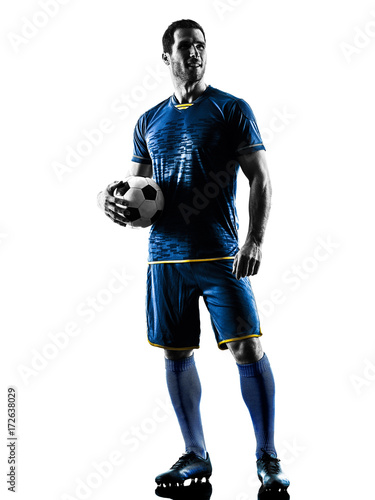 one caucasian soccer player man standing in silhouette isolated on white background