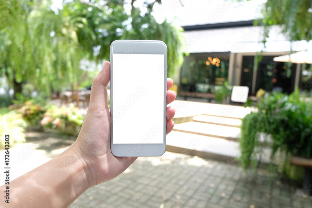 Close up of women's hands holding cell telephone blank copy space screen. smart phone with technology concept. Close up of women's hands holding cell telephone blank copy space screen. smart phone with technology concept.