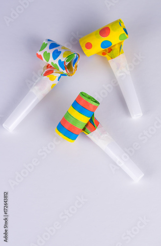 Three funny party horn on white background