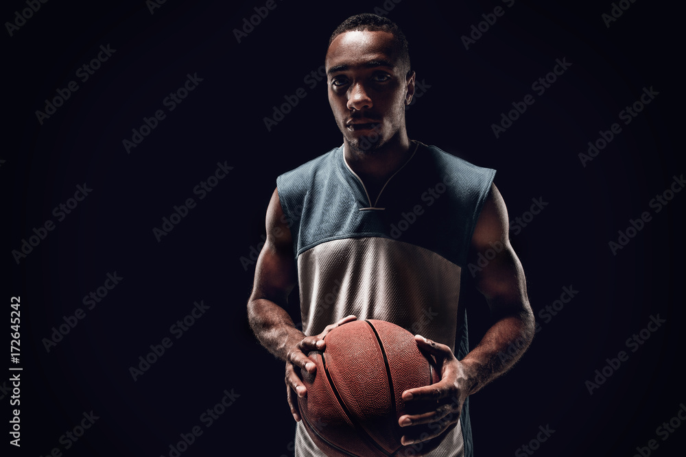 The portrait of a basketball player with ball The portrait of a basketball player with ball