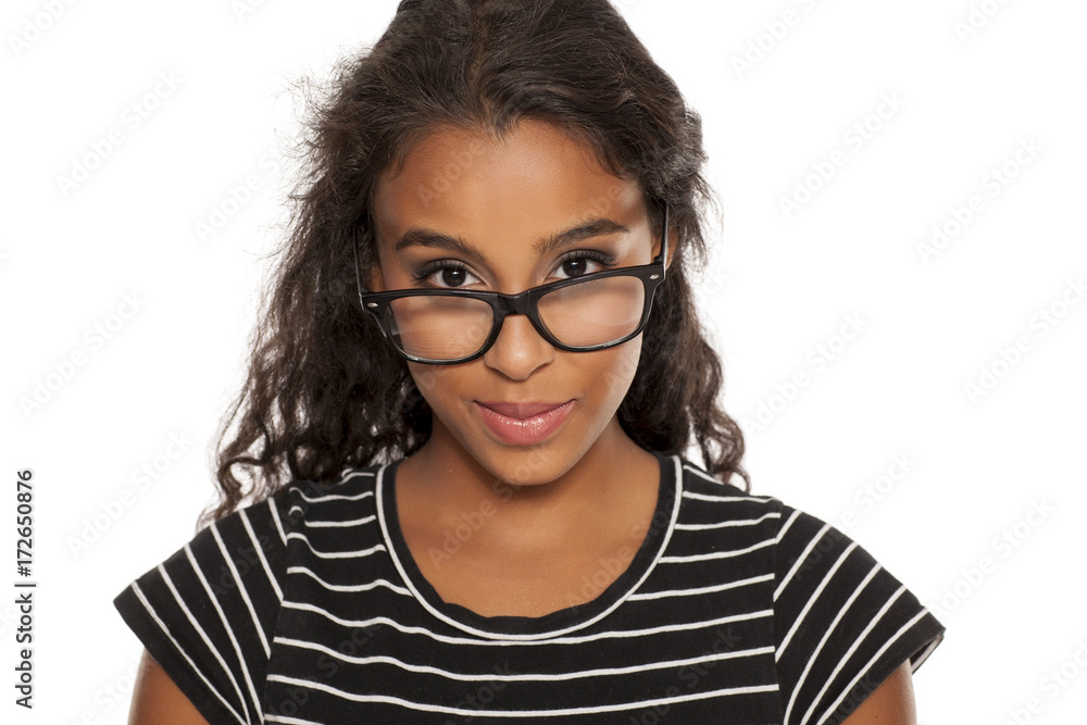 beautiful young dark skinned woman posing with eyeglasses