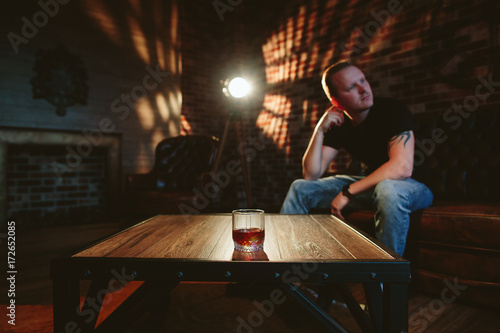Man in depression with alcohol