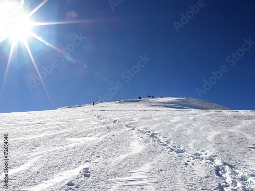 Mountaineers climbing the snowy peak of mountin Ararat in Turkey in the morning sun 