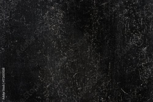 white powder chalk on black chalkboard texture