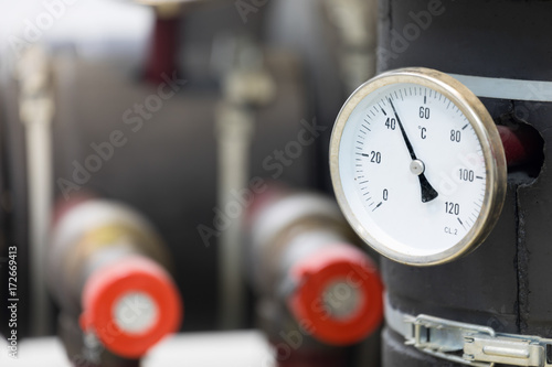 Photos industrial analog thermometer at the boiler room