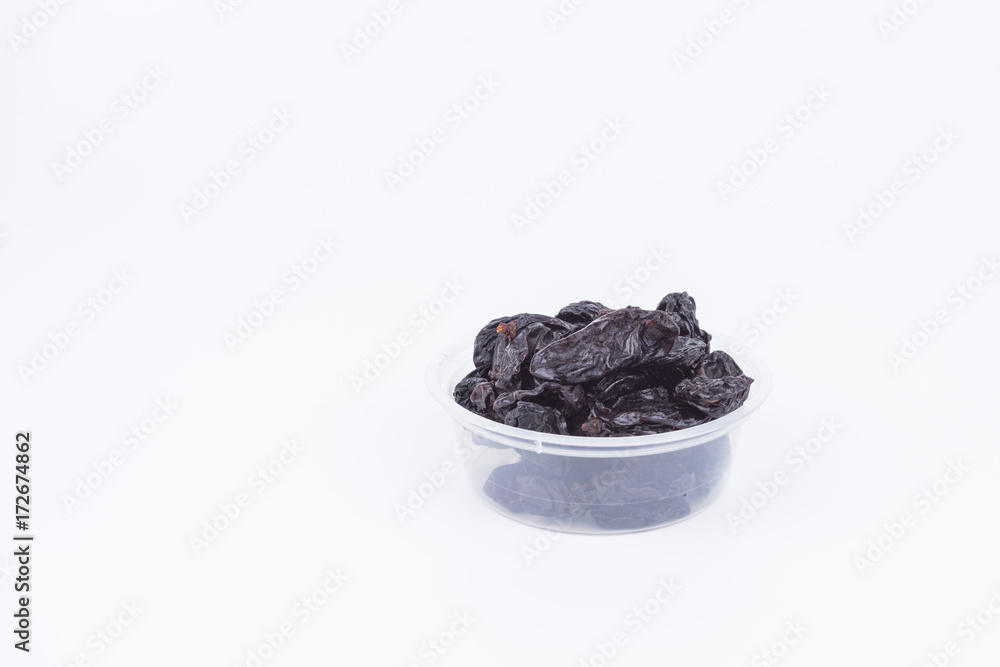 Concept Sweet dry raisins black and yellow isolated on the white background
