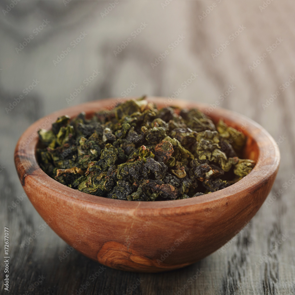 oolong green tea in olive bowl oolong green tea in olive bowl