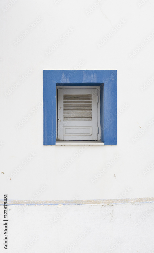 old blue painted wooden window