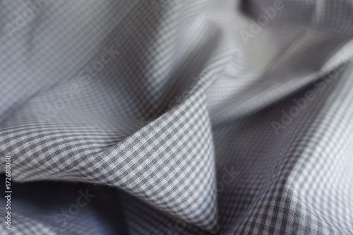Gray checkered cotton fabric in soft folds