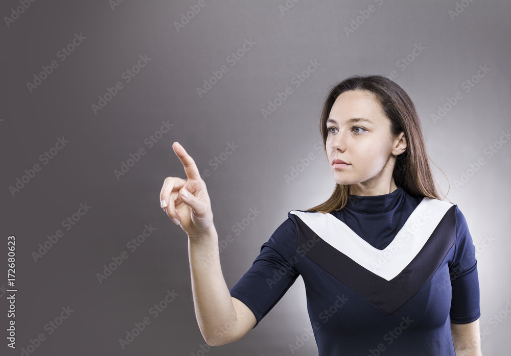 Woman touching the virtual interface Woman touching the virtual interface
