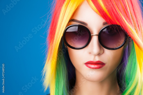 beautiful woman wearing color wig and sunglasses