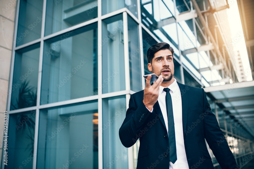 Travelling businessman making phone call Travelling businessman making phone call