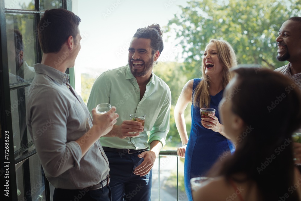 Group of friends interacting with each other while having Group of friends interacting with each other while having