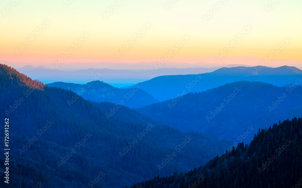  blue misty silhouettes of mountains