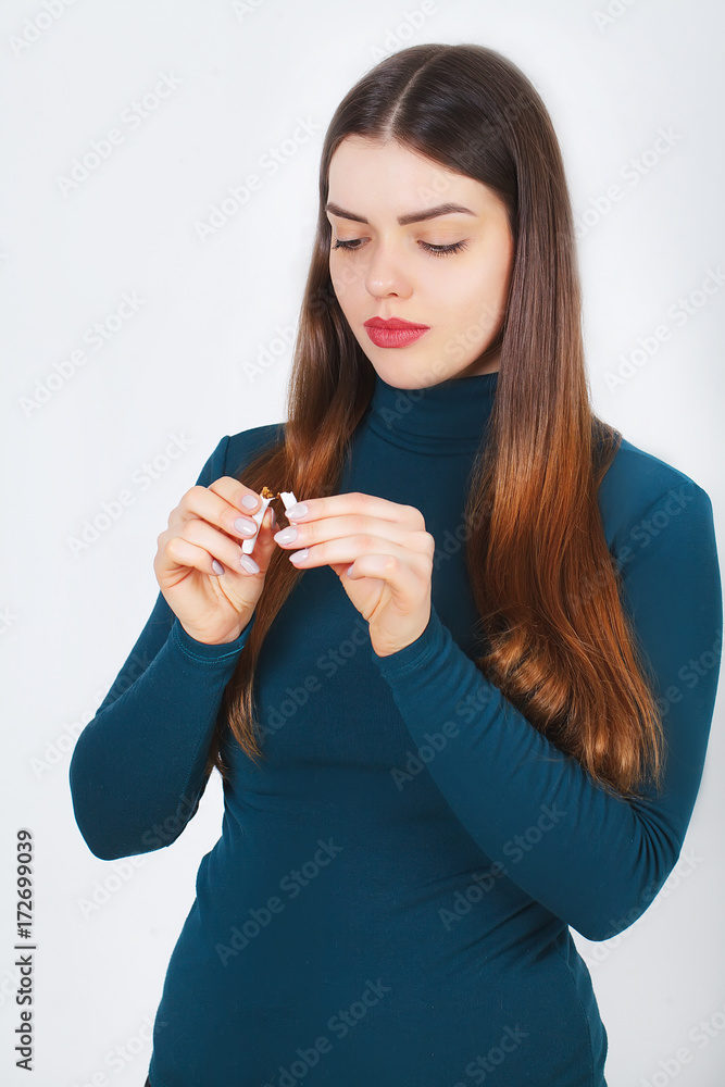 Beautiful Woman Holding Broken Cigarette. Quitting Cigarettes Beautiful Woman Holding Broken Cigarette. Quitting Cigarettes