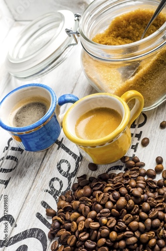 cup of coffee and coffee beans and cane sugar