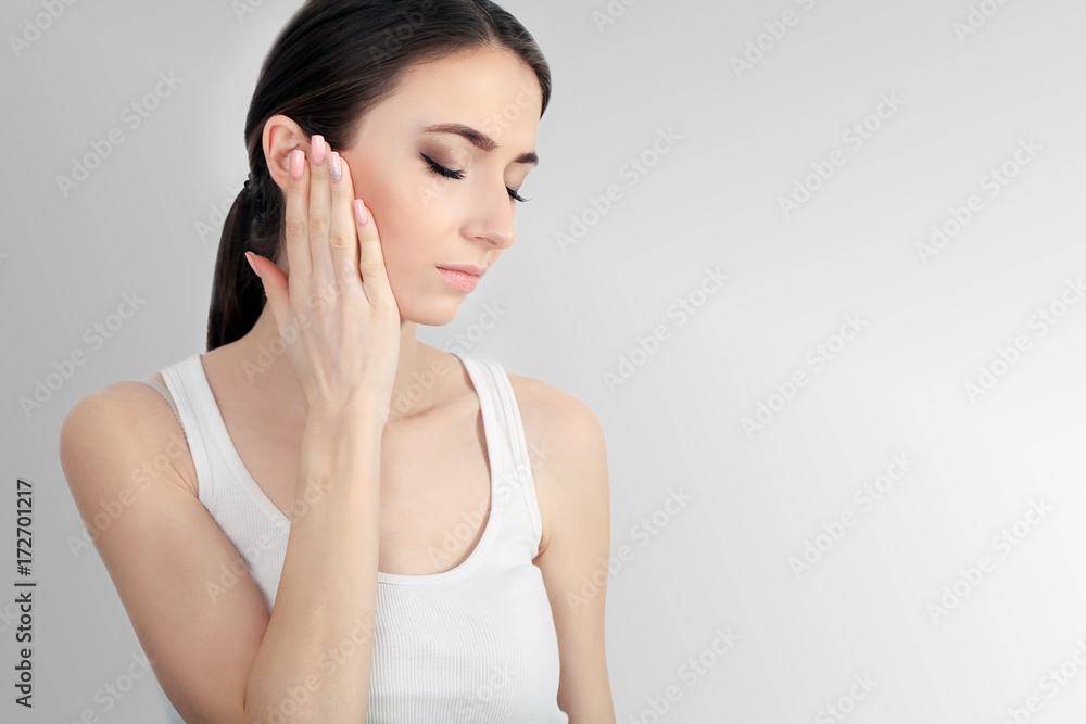 Young sad woman touch forehead and feel strong head ache Young sad woman touch forehead and feel strong head ache