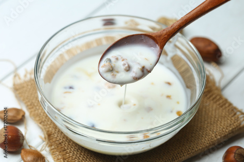 nuts yogurt in glass bowl