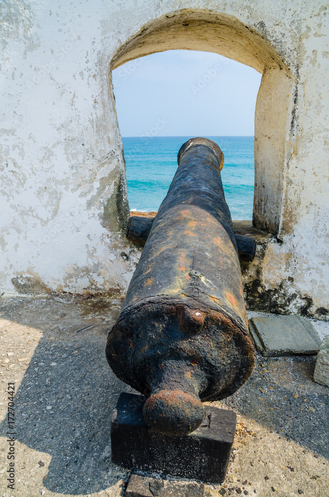 Famous slave trading fort of colonial times Cape Coast Castle with old cannons and white washed walls, Ghana, Africa